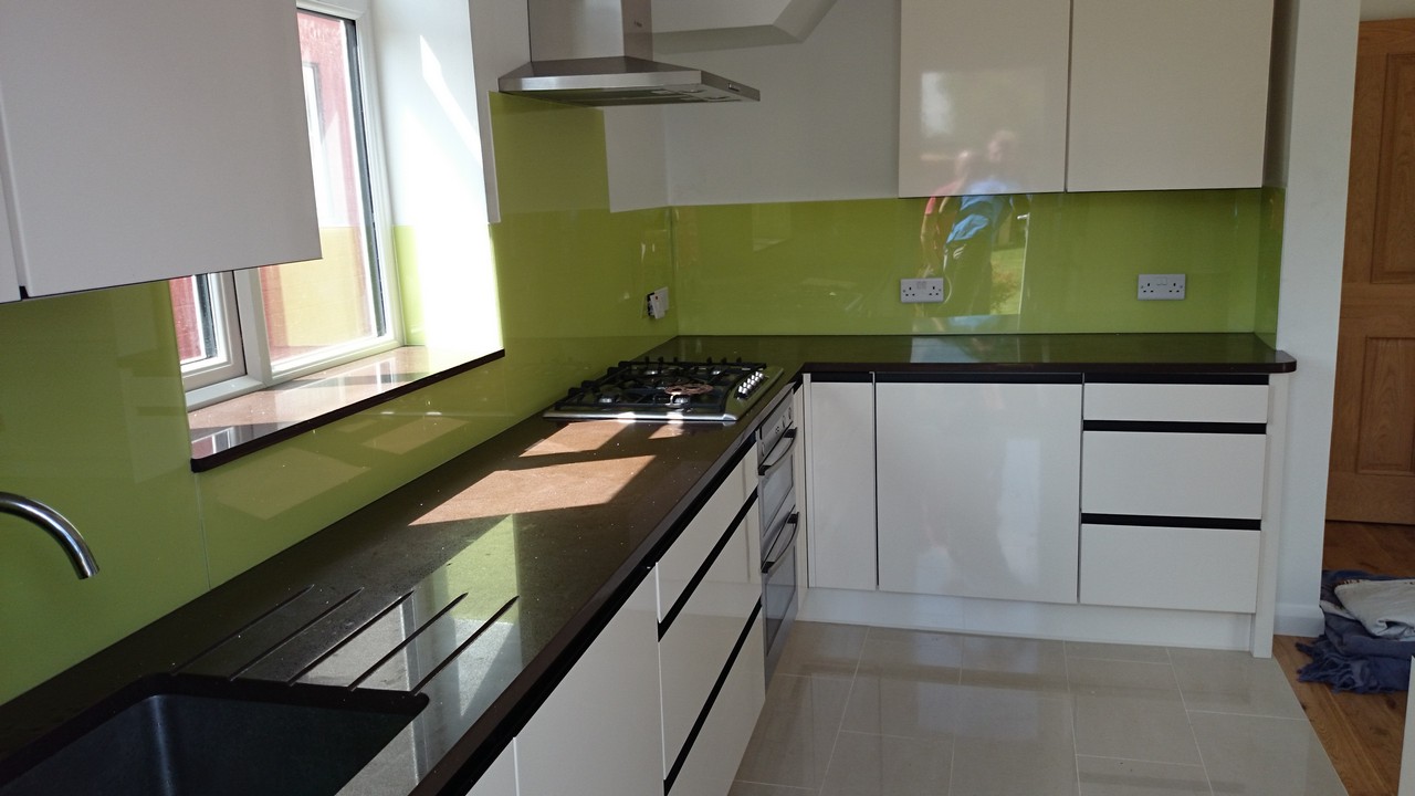 Lime green glass kitchen splashback installed by Hampton glaziers