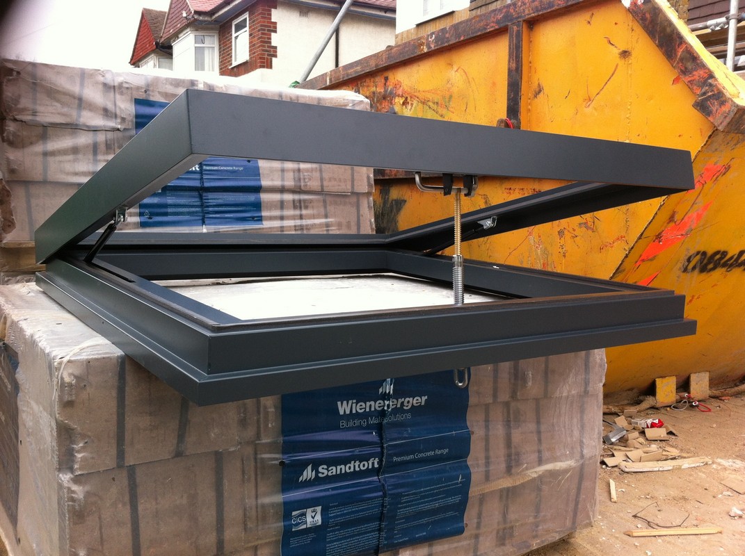 Opening flat roof skylight in anthracite grey installed in Hampton