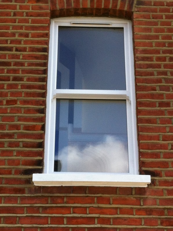 uPVC sash window on Victorian red brick house in Hampton
